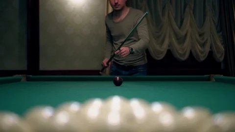 Man playing billiards Stock Footage 98450623