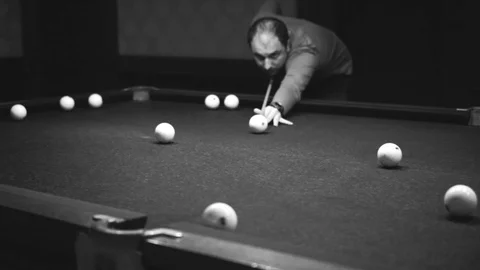 Man playing billiards Stock Footage 98450661