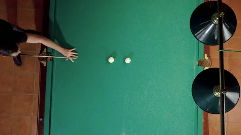 Man playing billiards, hitting balls with cue into pockets on billiard table. 4K 库存影片 110288771