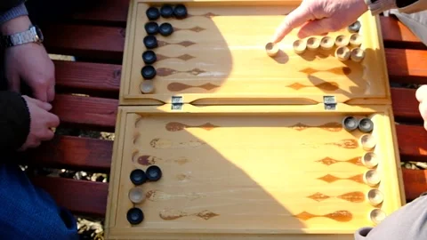 A man is playing a board game "backgammon" Video stock 152113726