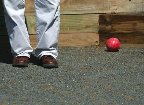 Man playing bocce ball Stock Photos