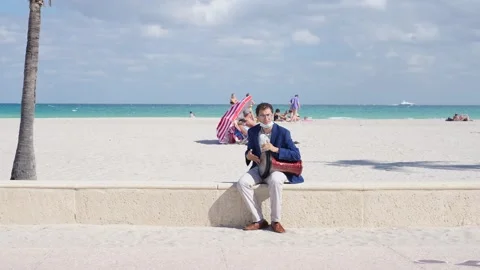 Man Playing Bongo Drum on the Beach During Covid Pandemic Stock-Footage 158345203