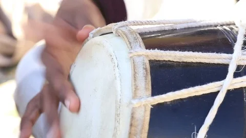 Man playing on a Bongo drum close up.  Drums hands, movement, rhythm. India Stock Footage 75566448