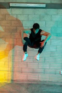 Man playing breakdance in a cellar Stock Photos