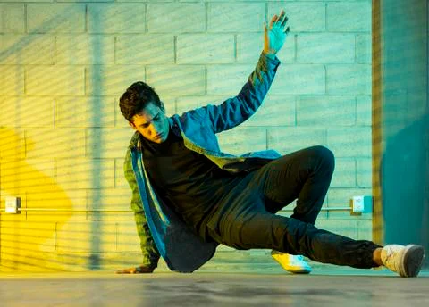 Man playing breakdance in a cellar Stock Photos