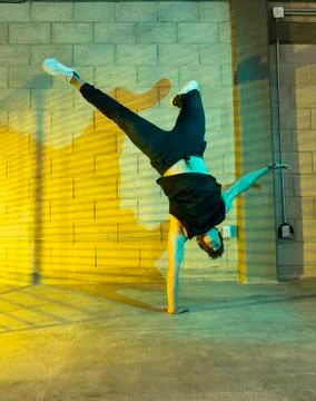 Man playing breakdance in a cellar Stock Photos