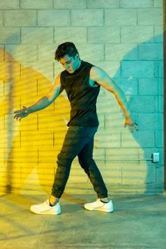 Man playing breakdance in a cellar Stock Photos