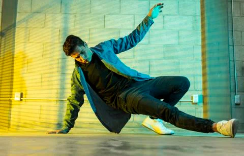 Man playing breakdance in a cellar Stock Photos