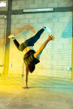 Man playing breakdance in a cellar Stock Photos
