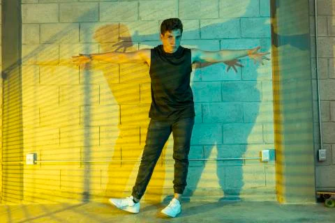 Man playing breakdance in a cellar Stock Photos
