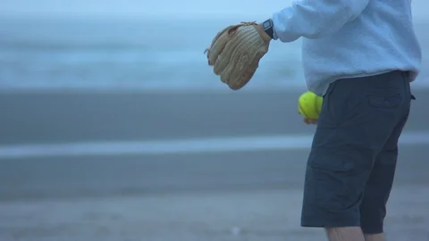 Man Playing Catch on the Oregon Coast Stock Footage 96010676