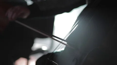 Man playing the cello on the dark. Video stock 73451916