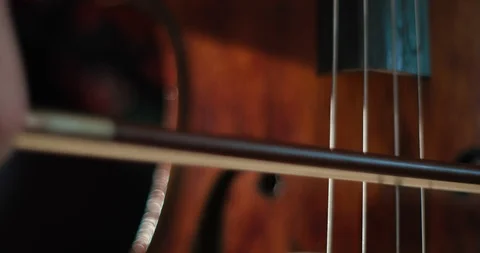 Man playing cello in darkness Stock Footage 86484539