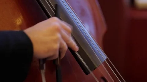 Man playing the cello finger closeup. Video stock 72648743