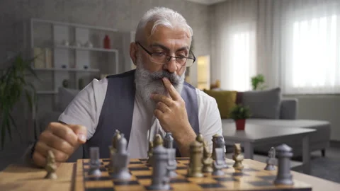 Man playing chess alone at home. Stock Footage 220634984