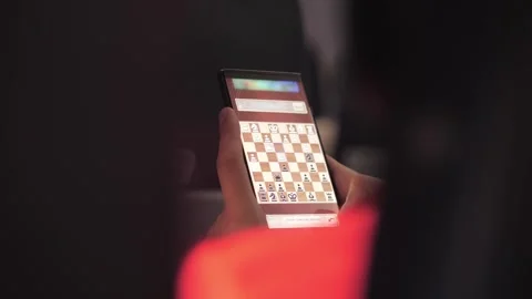 Man playing chess online using chess on phone Stock Footage 316077829