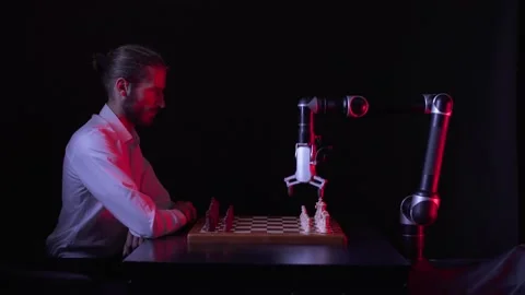 Man playing chess with a robot, the confrontation between man and artificial Stock Footage 133217508
