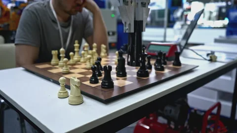 Man is playing chess with robot. Media. Man is playing chess against robot at Stock Footage 277678424