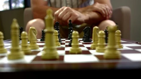 Man playing chess in room Stock Footage 93518975