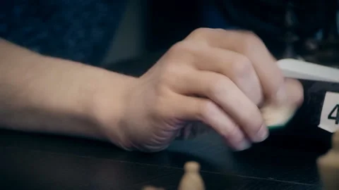 Man playing chess at the table, hands close-up waiting for the move Stock Footage 125020129