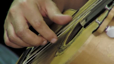 A Man Playing A Chilean Stringed Instrument Called "Guitarron". Close Up. Stock Footage 271609662