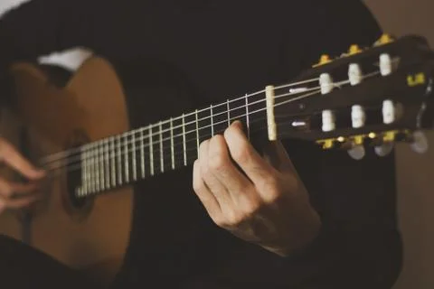 Man playing classical guitar. Close-up Stock Photos