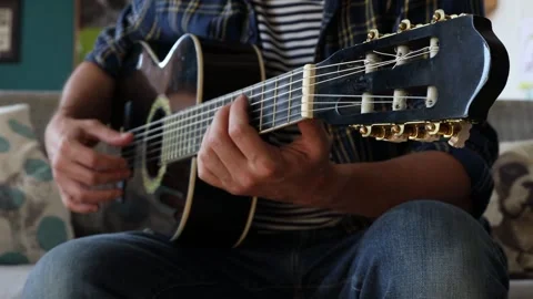 Man playing classical guitar at home. Stock-Footage 244878034
