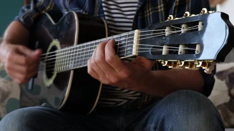 Man playing classical guitar at home. Stock-Footage 244878259