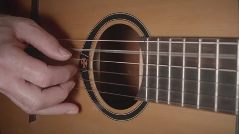 Man playing classical nylon string acoustic guitar - close up - original tune 01 Stock Footage 156518297