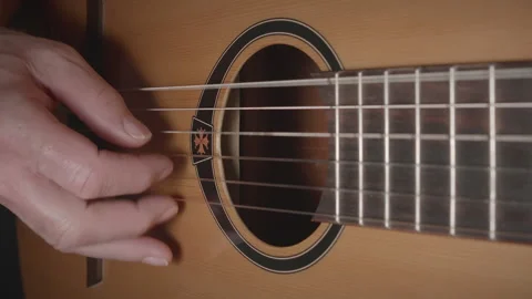 Man playing classical nylon string acoustic guitar - close up - original tune 02 Stock Footage 156518371