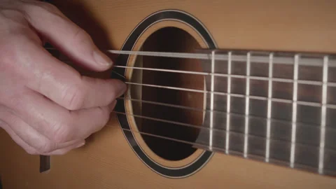 Man playing classical nylon string acoustic guitar - close up - original tune 03 Stock Footage 156518487