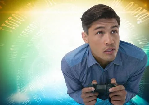 Man playing with computer game controller with bright colorful background Foto stock
