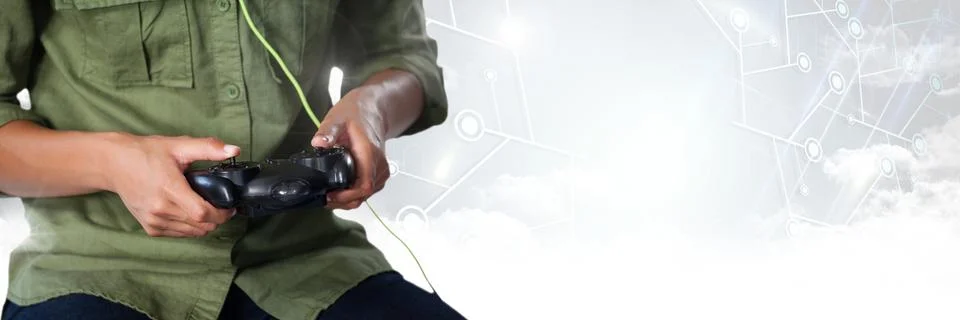 Man playing with computer game controller with bright background 스톡 사진