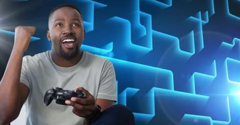 Man playing with computer game controller Foto stock