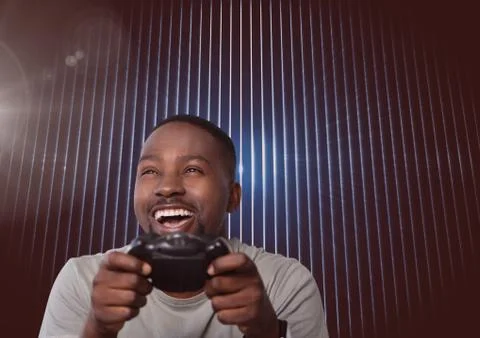 Man playing with computer game controller Foto stock