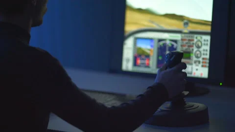 The man playing in computer game with a joystick. evening night time Video stock 86908577