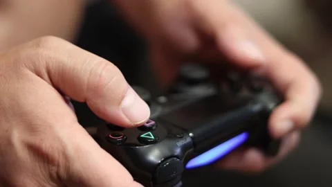 Man playing computer game with joystick Stock Footage 135840118