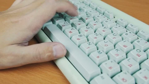 A man playing a computer game, the keyboard controls Stock Footage 70169514