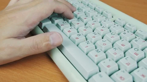 A man playing a computer game, the keyboard controls Stock Footage 70169810