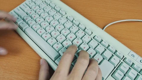 A man playing a computer game, the keyboard controls Stock Footage 70169864