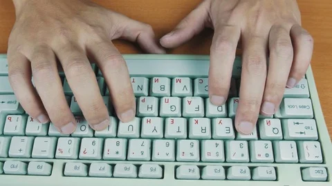 A man playing a computer game, the keyboard controls Stock Footage 70170019
