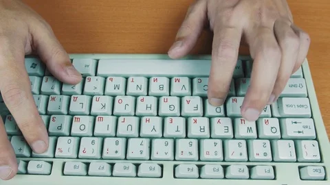 A man playing a computer game, the keyboard controls Stock Footage 70170257