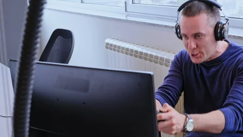 Man playing computer games in the office Stock-Footage 94715714