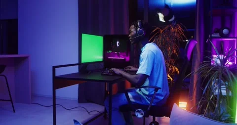 Man playing computer games sitting in front of. Stock Footage 318944306