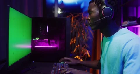 Man playing computer games sitting in front of. Stock Footage 318997411