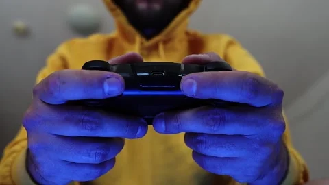Man playing on a console with a gamepad. Stock Footage 252324183