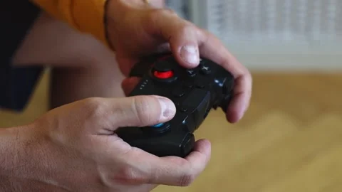 Man playing on a console with a gamepad. Stock-Footage 252324801