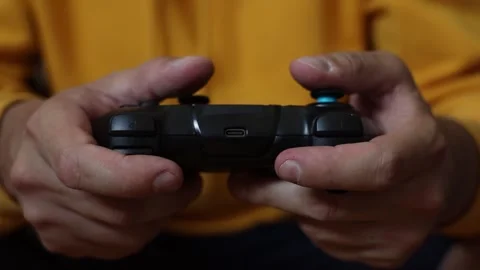 Man playing on a console with a gamepad. Stock-Footage 252325216