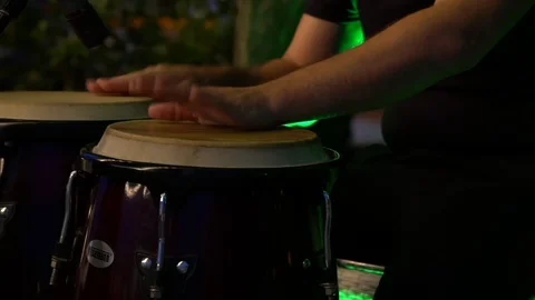 Man playing the djembe,  drum, musical concept, beautiful lighting on the stage Stock Footage 92786898