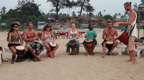 Man playing on drum at the Arambol beach. Stock Footage
